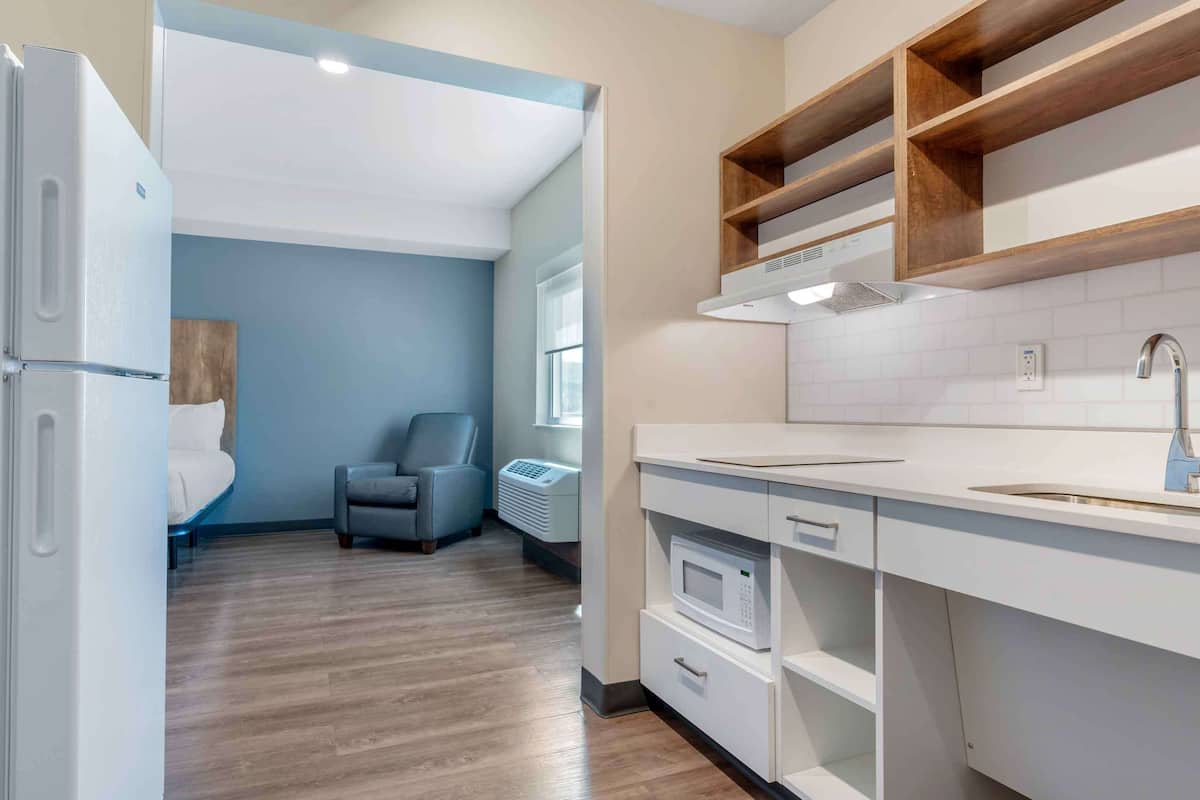 desk, iron/ironing board, bed sheets