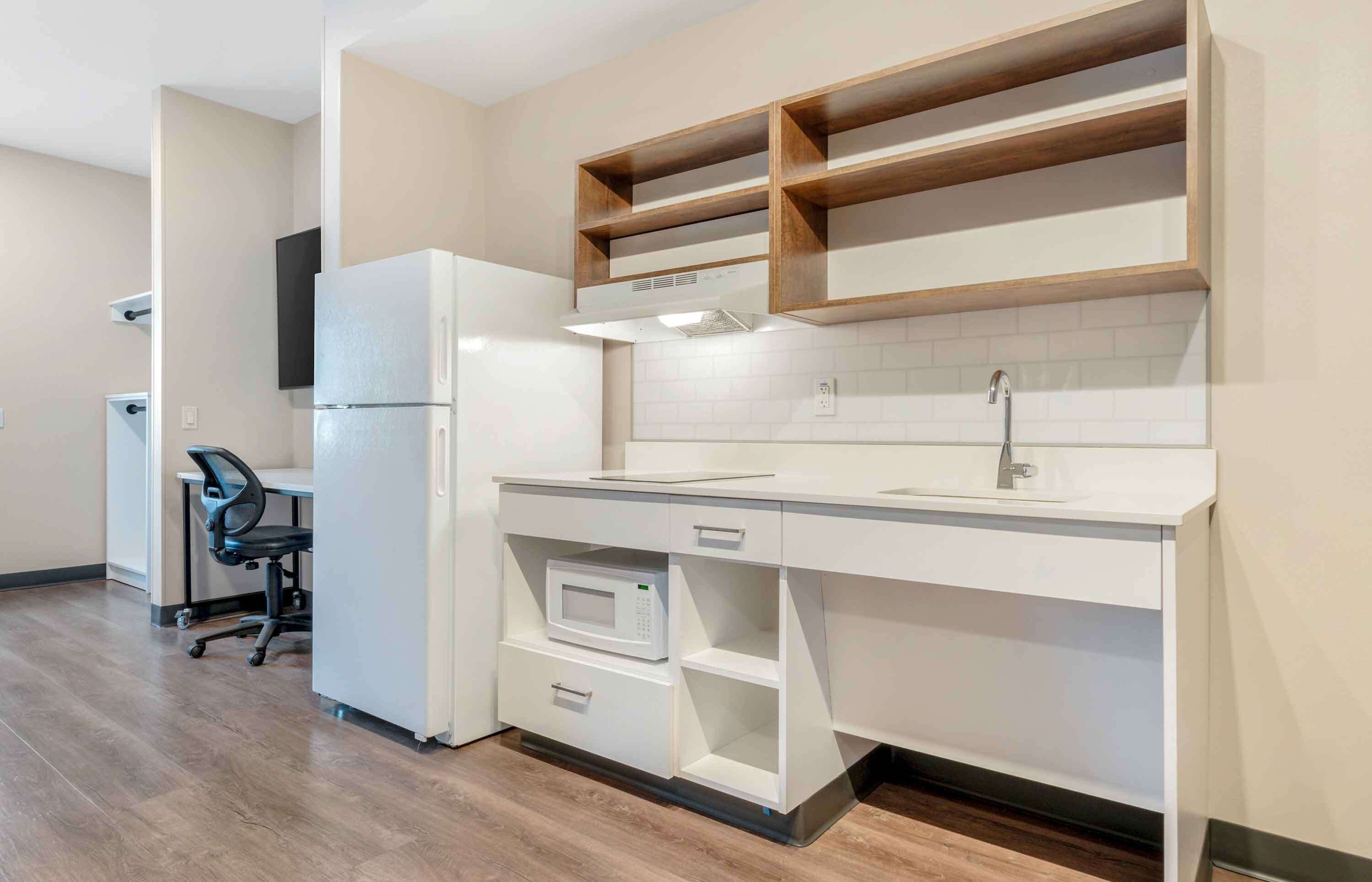 desk, iron/ironing board, bed sheets