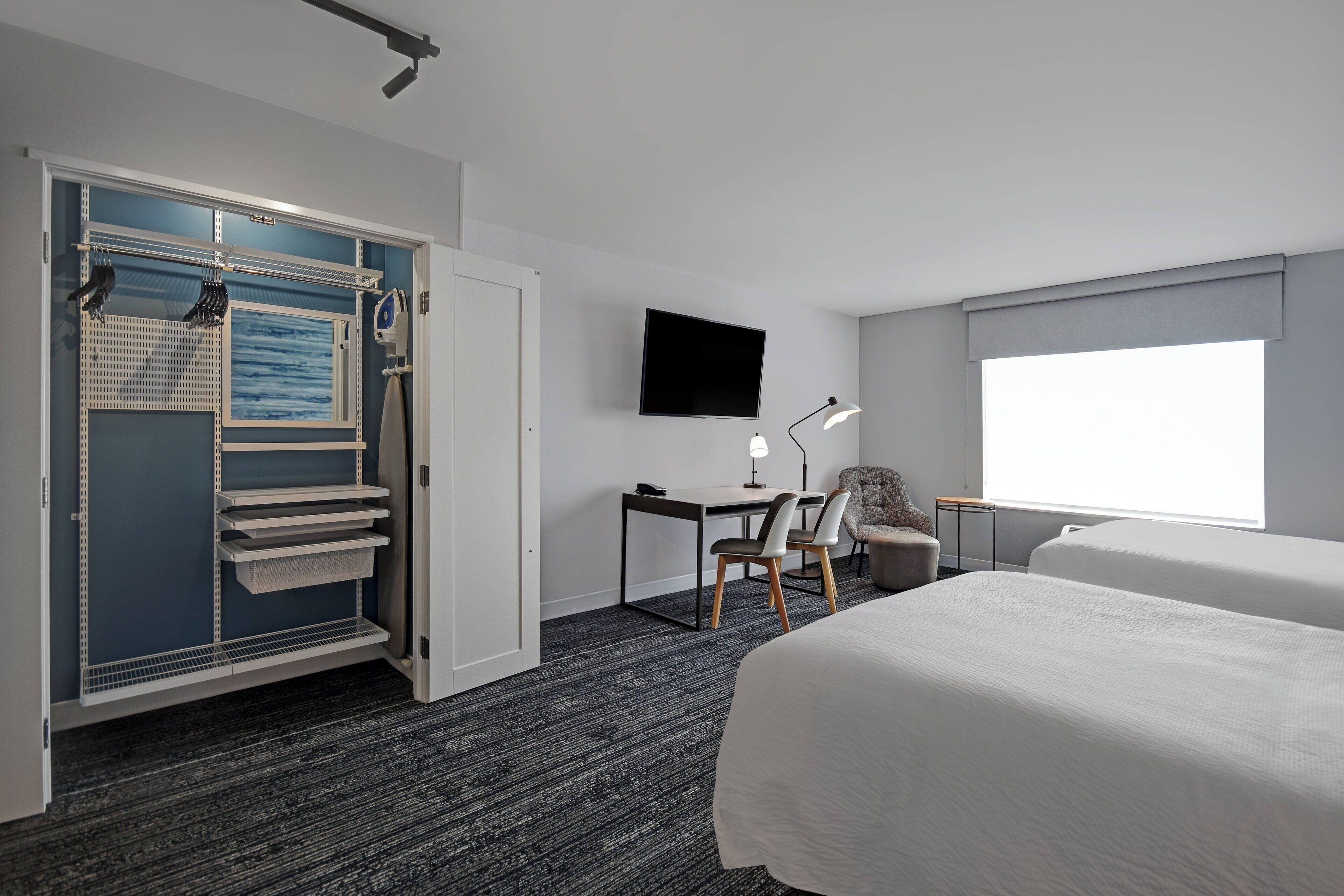 desk, laptop workspace, iron/ironing board, rollaway beds