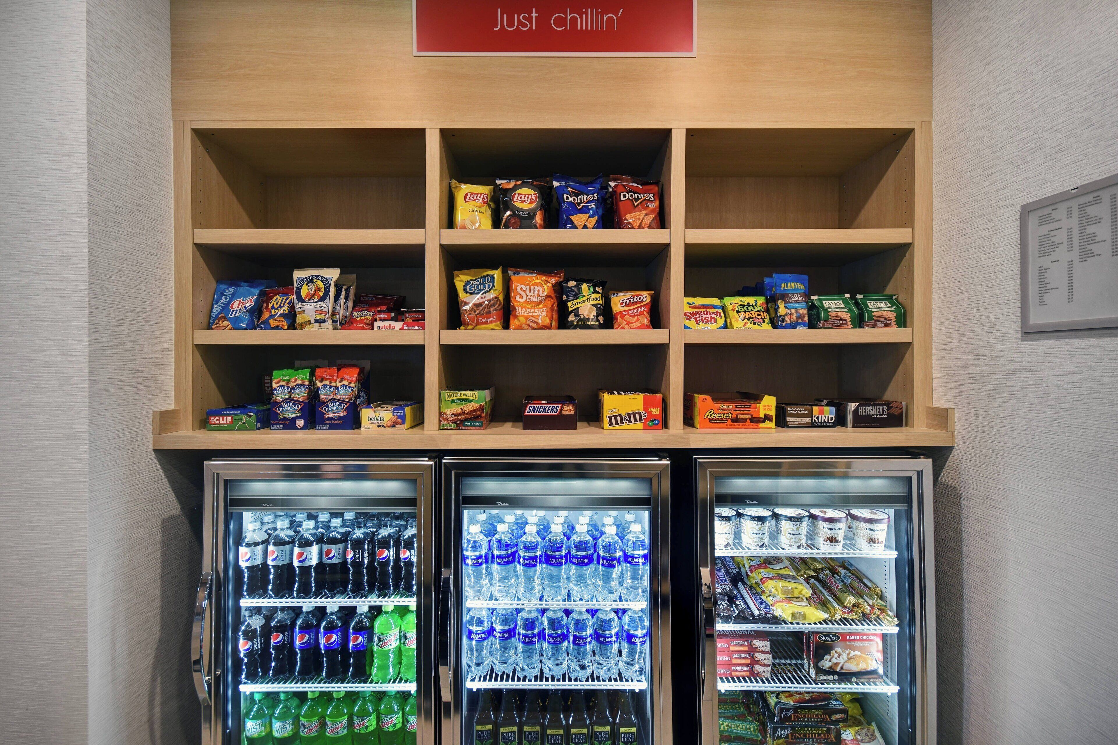 A snack and beverage vending area with various snacks and drinks.