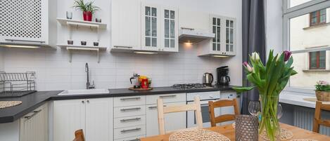 Apartment | Private kitchen | Fridge, microwave, stovetop, cookware/dishes/utensils
