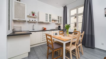 Apartment | Private kitchen | Fridge, microwave, stovetop, cookware/dishes/utensils