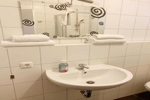 Shower, towels, soap, toilet paper