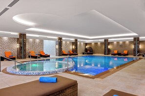 2 indoor pools, outdoor pool, open 8:00 AM to 10:30 PM, pool umbrellas