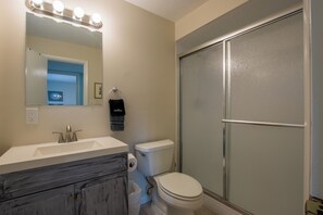 Shower, hair dryer, towels, soap