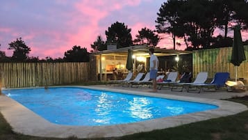 Outdoor pool, open 7:00 AM to 11:30 PM, pool umbrellas, pool loungers
