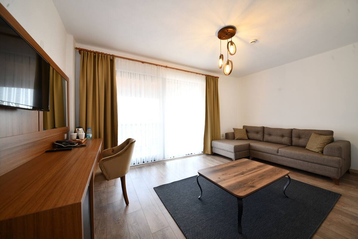 luxury double or twin room, multiple bedrooms, sea view | living area | 32-inch lcd tv with satellite channels, tv