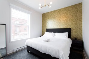 1 bedroom, desk, iron/ironing board, travel crib