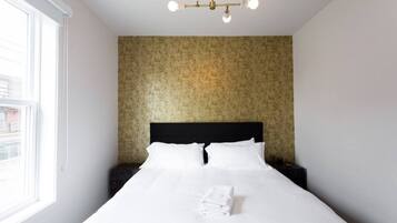 1 bedroom, desk, iron/ironing board, travel crib