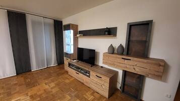 Apartment | Living area | 50-inch flat-screen TV with cable channels, TV