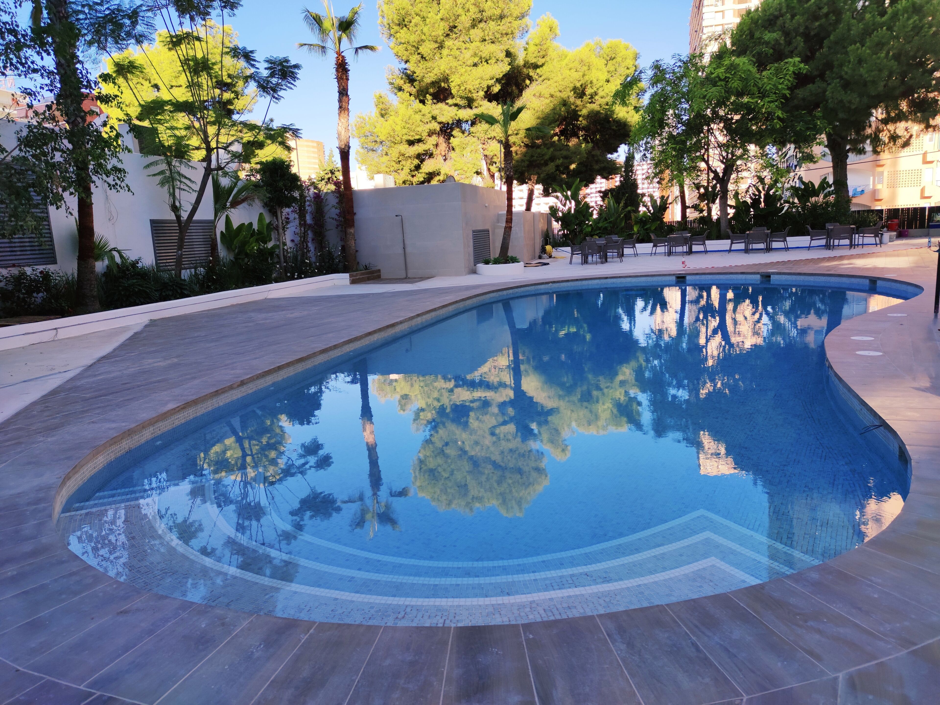 outdoor pool, open 10:00 am to 8:00 pm, pool loungers