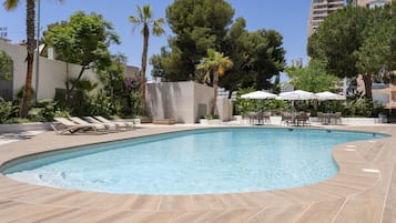 Outdoor pool, open 10:00 AM to 8:00 PM, pool loungers