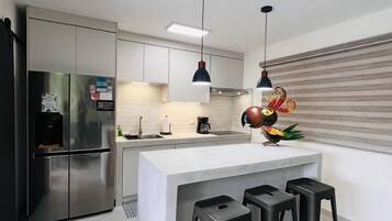 Fridge, microwave, stovetop, coffee/tea maker