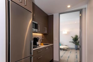 Fridge, microwave, stovetop, coffee/tea maker