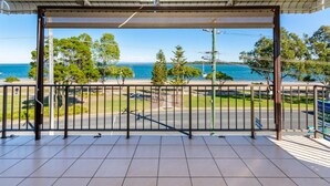A balcony with a view of the sea and a road. - Boasting some of Bribie's Best Waterviews (BONGAREE)
