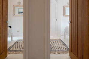 Upstairs landing connecting four bedrooms and family shower room, pet-friendly period holiday home in Rhosneigr, Anglesey