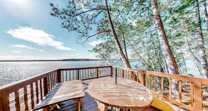 Lakefront home with dock, swimming area, & wood stove - sunset views