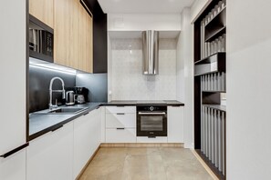 Premium Apartment | Private kitchen | Fridge, stovetop, dishwasher, electric kettle