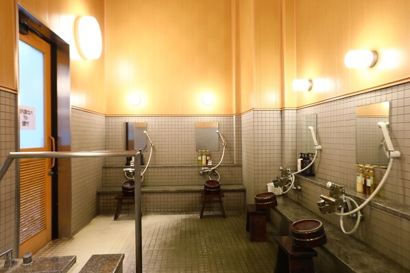A public restroom with multiple sinks, mirrors, and hand dryers. - Spa Village Yumesannsou (Nikko)
