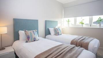 2 dormitorios, tabla de planchar con plancha, cuna de viaje y wifi