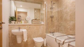 Bathtub, hair dryer, towels