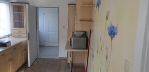 Apartamento | Cocina privada | Hervidor eléctrico, tostadora y utensilios de cocina