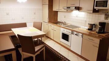 Apartment | Private kitchen | Full-size fridge, microwave, stovetop, dishwasher