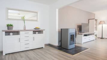 Apartment | Living area | 25-inch LED TV with cable channels, DVD player