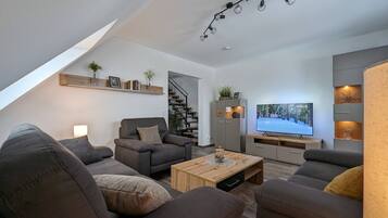 Apartment | Living area | 25-inch LED TV with cable channels, DVD player