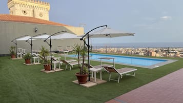 Outdoor pool, open 9:30 AM to 6:00 PM, pool umbrellas, sun loungers