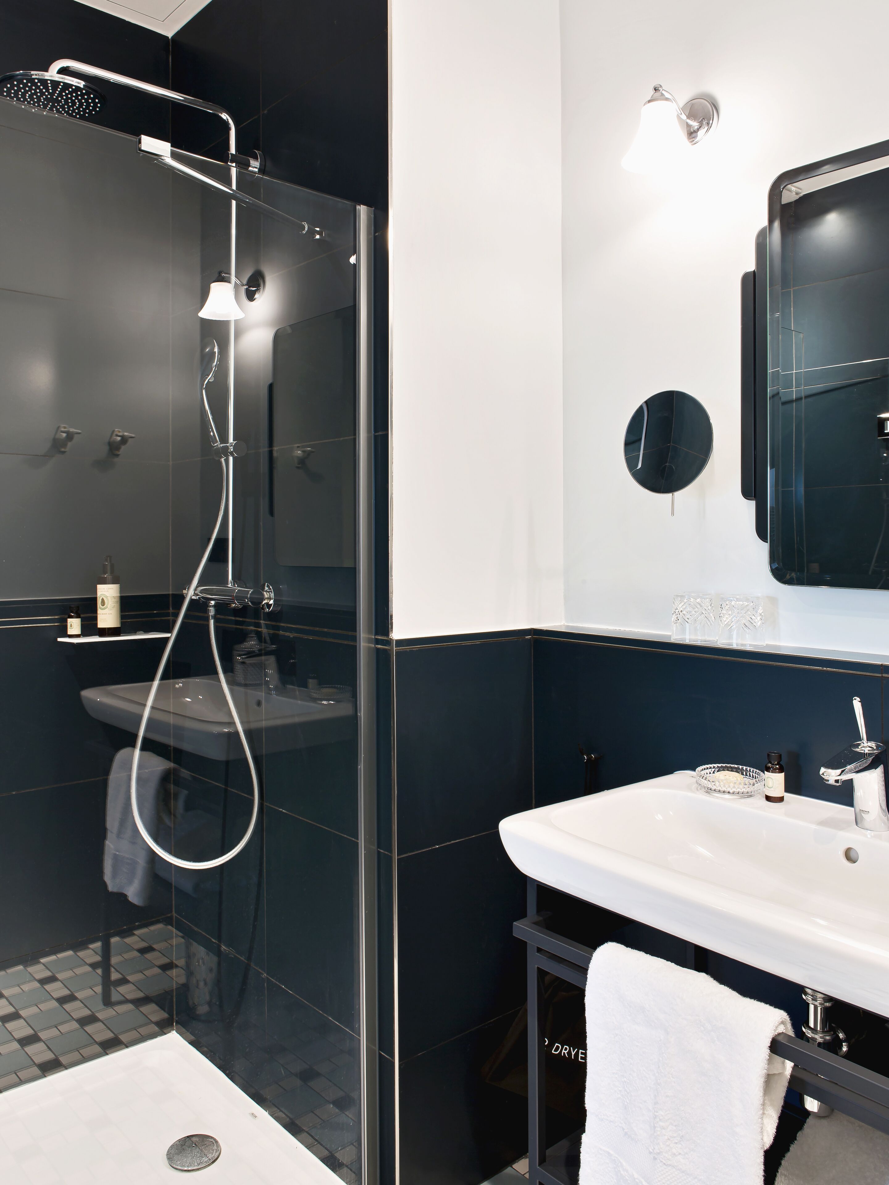 designer toiletries, hair dryer, slippers, towels