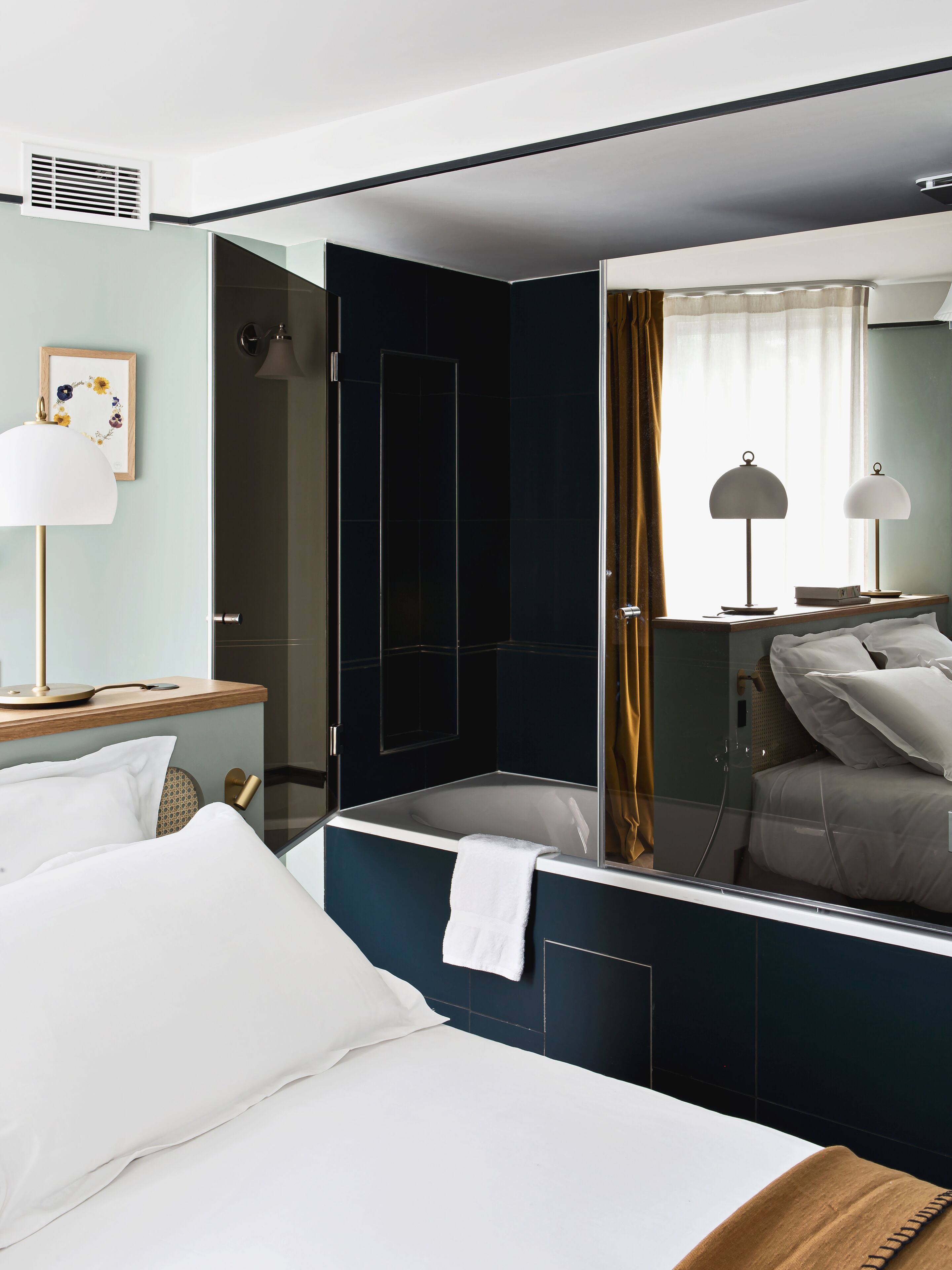 designer toiletries, hair dryer, slippers, towels