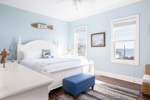 Your third-floor king bedroom has an en suite bathroom and incredible views of the ocean
