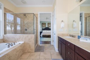 Your en suite features a deep soaking tub and walk-in shower