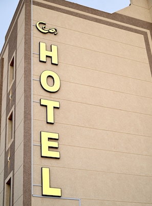 A hotel sign with the word "HOTEL" in large, bold letters.