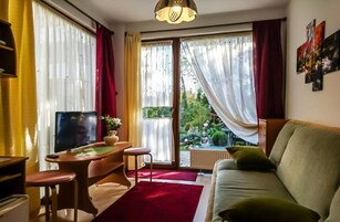 Basic Triple Room | Living room | Flat-screen TV