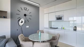 Exclusive Apartment | Living area | 30-inch TV with cable channels