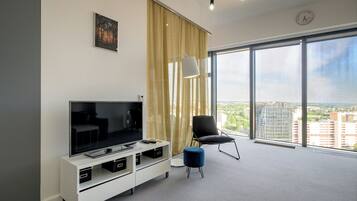 Exclusive Apartment | Living area | 30-inch TV with cable channels