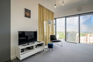 Exclusive Apartment | Living area | 30-inch TV with cable channels