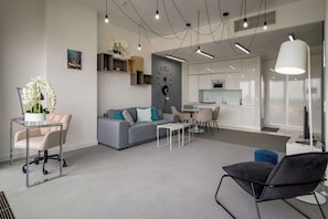 Exclusive Apartment | Living area | 30-inch TV with cable channels