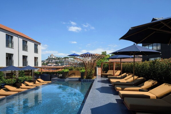 Outdoor pool, open 10:00 AM to 9:00 PM, pool loungers