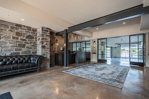 Relax in the stylish lobby with a comfortable sofa and modern reception desk.