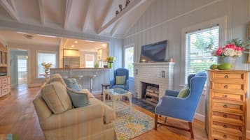 House, Multiple Beds (SeaGrape Cottage) | Living room | TV, fireplace