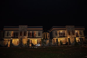 A two-story house with a stone facade, multiple windows, and a gated entrance. - Konga Hotel Kigali (Kigali)