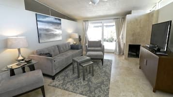 Condo, Multiple Beds (Casa Aralia) | Living room | TV, fireplace