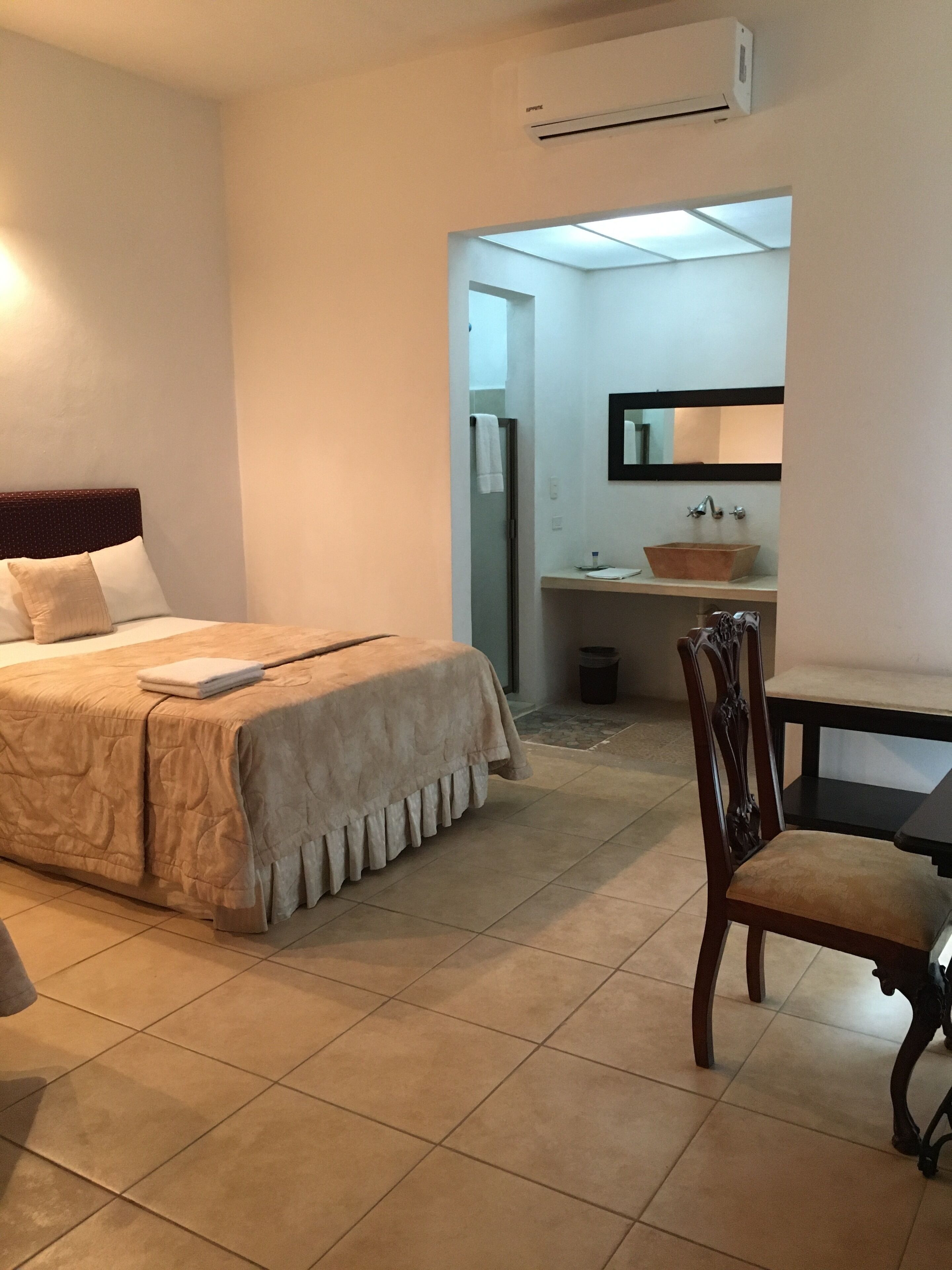 standard room | bathroom | shower, rainfall showerhead, hair dryer, towels