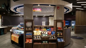 A snack kiosk with a variety of packaged snacks and beverages. - Tru By Hilton Chambersburg, PA (Chambersburg)