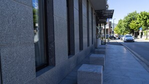 A modern building with large windows and a stone facade. - Hotel Pasha (Mostar)