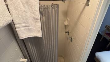 Compact Solo Room | Bathroom | Designer toiletries, hair dryer, towels, soap