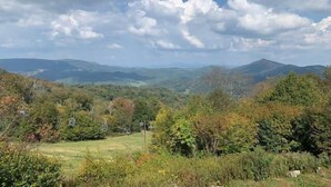 A mountainous landscape with a clear sky and scattered clouds. - Sugar Ski & Country Club Unit 811 Gold (Banner Elk)